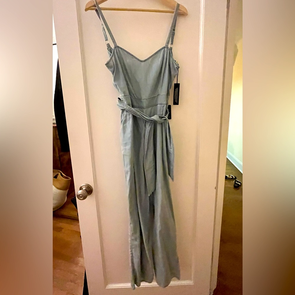Cute light denim look jumpsuit with cross cross back
